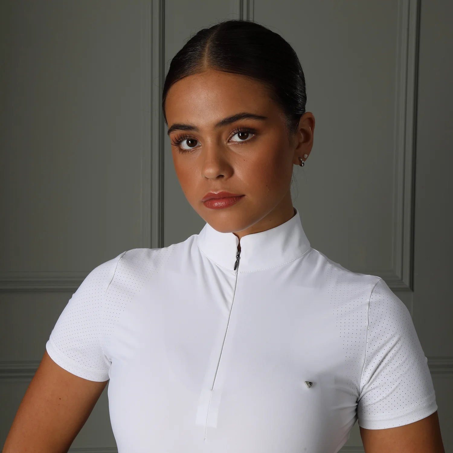 Close-up front view of model indoors wearing the Aubrion Walston Show Shirt in white