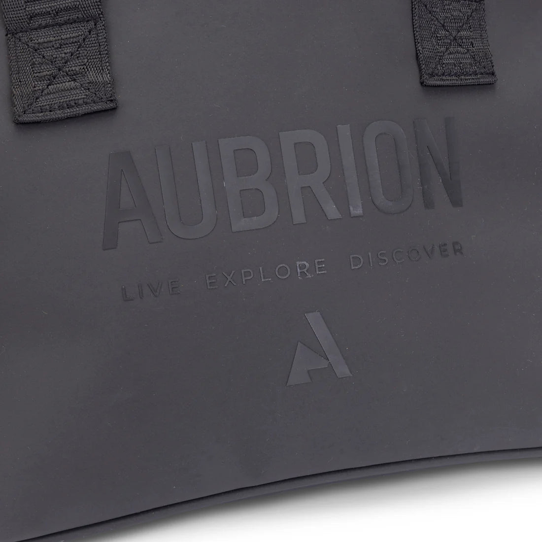 Close-up view of the tone-one-tone Aubrian name with "Live Explore Discover" on the front of the Aubrion React Helmet Bag