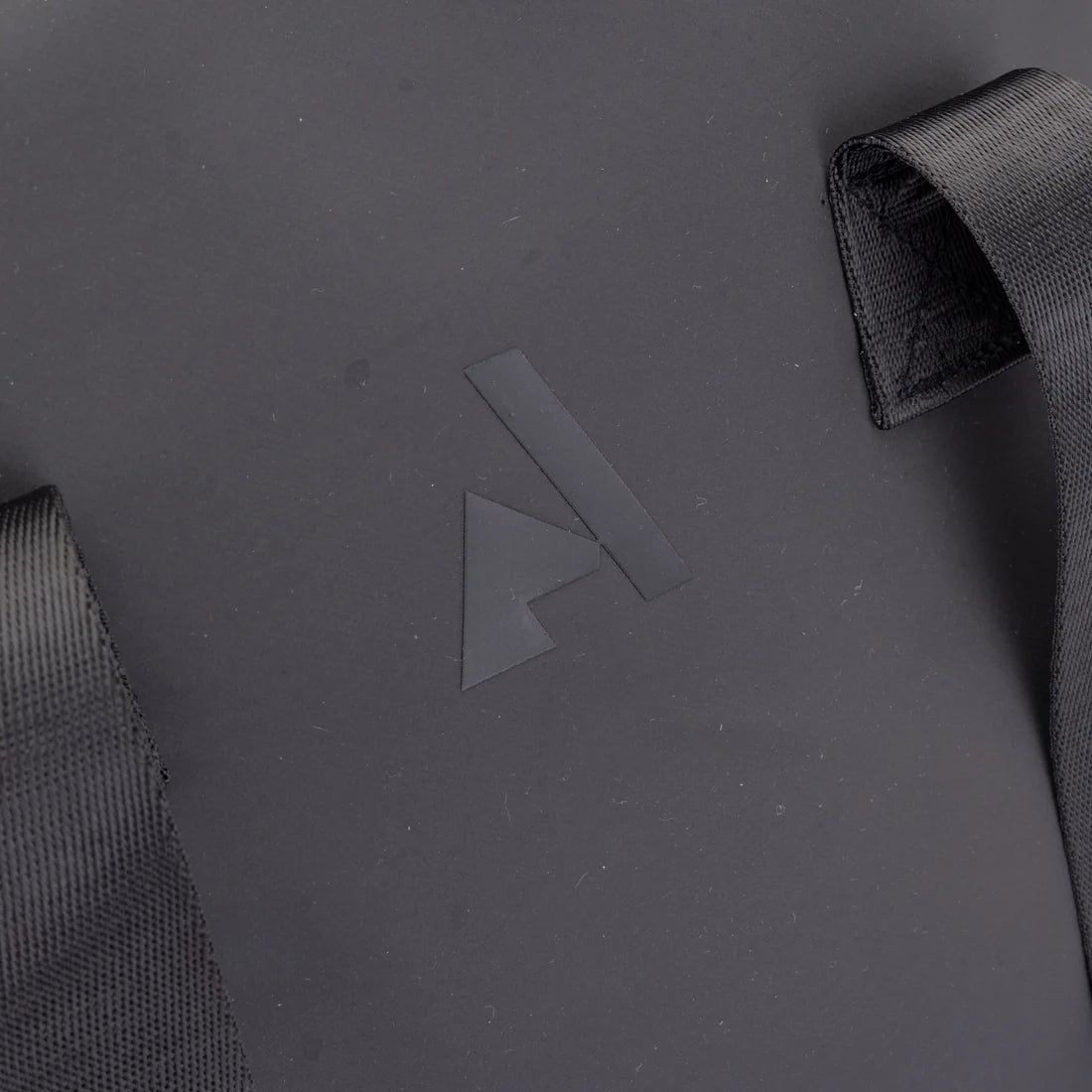 Close-up view of the Aubrion logo on the back of the Aubrion React Helmet Bag