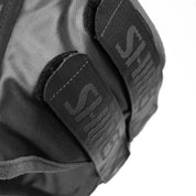 Close-up view of the underside straps on the Shires FlyGuard Pro Fine Mesh Fly Mask with Ears & Open Forelock in black and gray