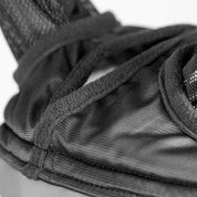 Close-up view of the forelock hole on the Shires FlyGuard Pro Fine Mesh Fly Mask with Ears & Open Forelock in black and gray