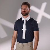 Front view of a male model wearing the navy Aubrion Men's Optima MX Button Show Shirt with a blurry MX in white on the gray backgorund