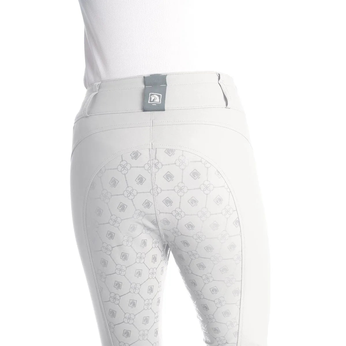 Back view of a model wearing the white Romfh Isabella Silicone Full Seat Breech on a plain background