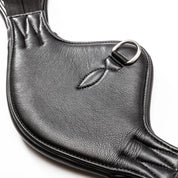 Close-up view of the Dring on the black Kavalkade Soft Casper Short Girth on a white background