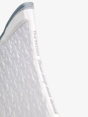 Spine view of the white PS of Sweden Crystal Satin Dressage Saddle Pad on a white background