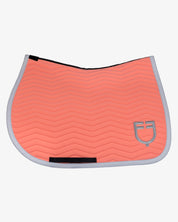 Side view of the Equestro Wave Quilting Jumping Saddle Pad In Technical Fabric in a coral color on a white background