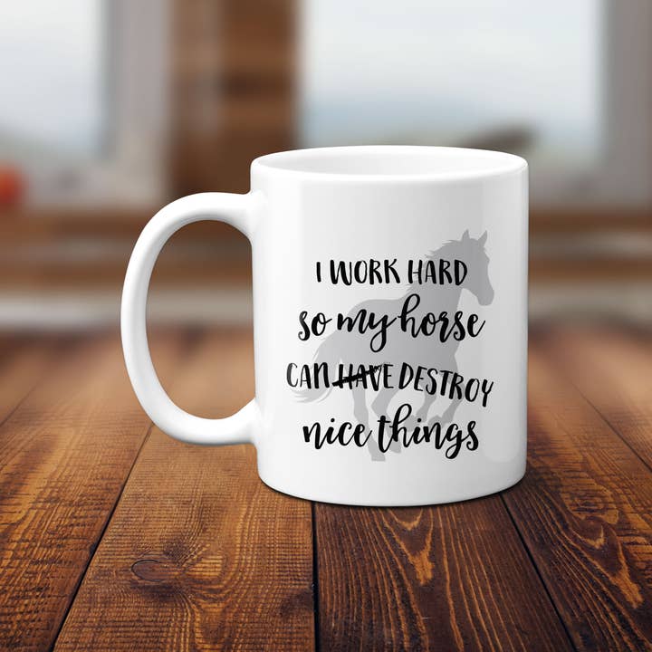 Front view of the Canary Road Horse Nice Things Coffee Mug on a wood table