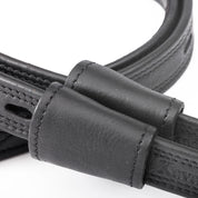 Close-up view of the keepers on the black Kavalkade Oiled Dressage Stirrup Leathers on a white background