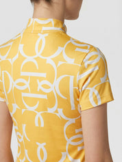 Back view of a model wearing the sunburst sorbet PS of Sweden Vera Printed Short Sleeve Top on a plain background