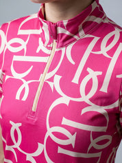 Front view of a model wearing the hot hibiscus PS of Sweden Vera Printed Short Sleeve Top on a plain background