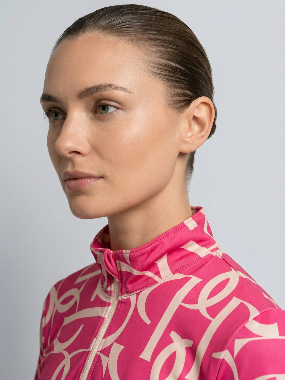 Close-up front view of a model wearing the hot hibiscus PS of Sweden Vera Printed Short Sleeve Top on a plain background