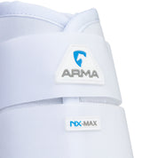 Close-up of Shires Equestrian ARMA NX-MAX brushing boot in white showing ARMA logo and NX-MAX label