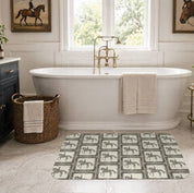 View of the All Designs Equine Dressage Horse Memory Foam Bath Mat on a bathroom floor with a tub in the background