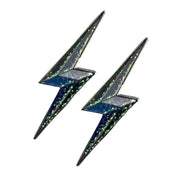 Front view of a pair of Lightning Bolt Dubois Cheval Number Pin Charm on a white background