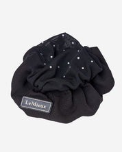 Top view of the black LeMieux Scrunchie With Crystal Hair Net on a plain background