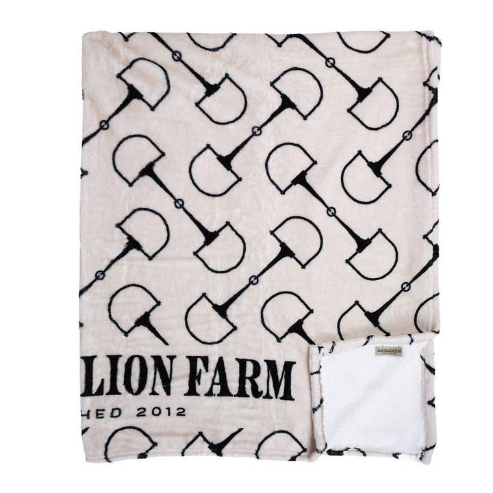 Folded up view of the snaffle Blue Stallion Farm Flannel Fleece Blanket in Leather Holder on a white background