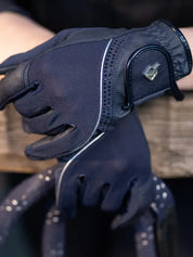 Close-up of navy LeMieux Crystal Gloves showing crystal detail on back of hand