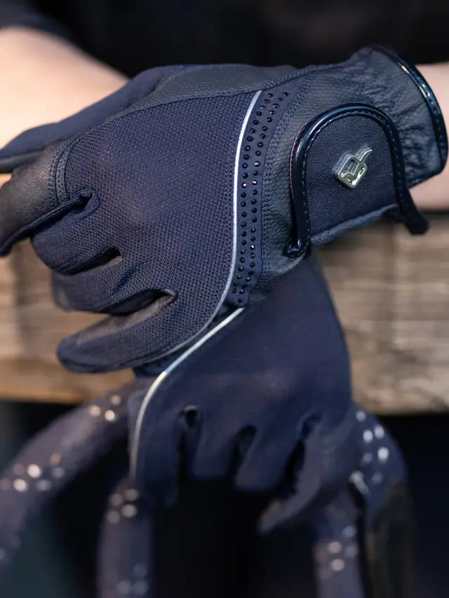 Close-up of navy LeMieux Crystal Gloves showing crystal detail on back of hand