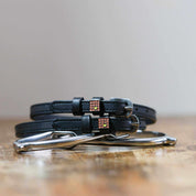 Front view of the Waffle Mane Jane Spur Straps on wood