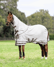 Horse wearing LeMieux Arika Sunstopper Sheet with neck cover standing in grassy field