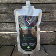 Front view of the 32oz Eucalyptus Sterling Essentials Leather Cleaner with a wood background