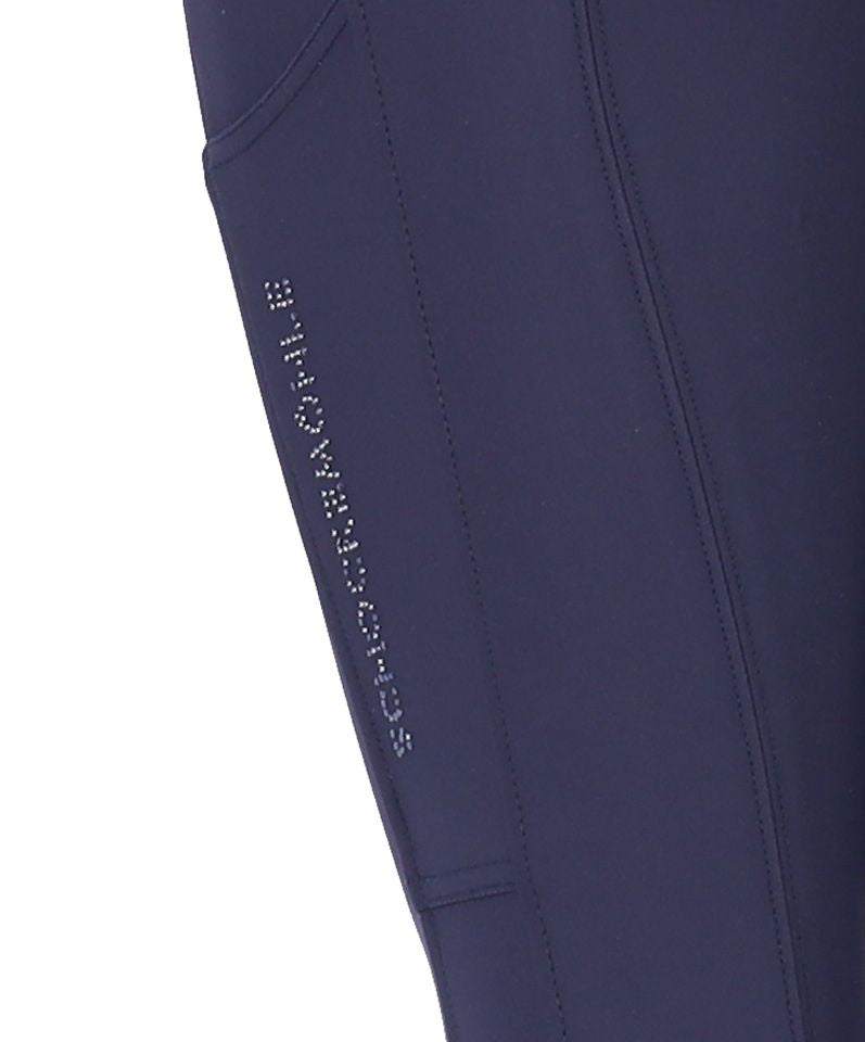Close-up side view of the Dark Blue Schockemohle Darleen Knee Grip Breeches on a white background