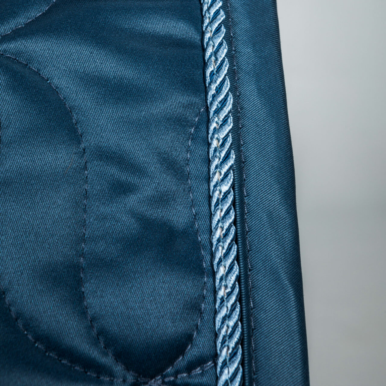 Close-up view of the cord on blueberry the Back on Track Deep Nights All-Purpose Saddle Pad