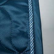 Close-up view of the cord on blueberry the Back on Track Deep Nights All-Purpose Saddle Pad