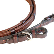 Close-up view of the buckle ends on the havana Nunn Finer Rubber Reins with Hand Stops on a white background