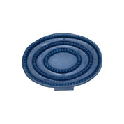 Underside view of the blue Partrade Rubber Curry on a white background