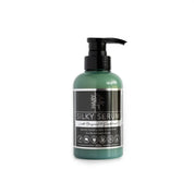 Bottle of Hairy Pony Silky Serum with pump dispenser on white background