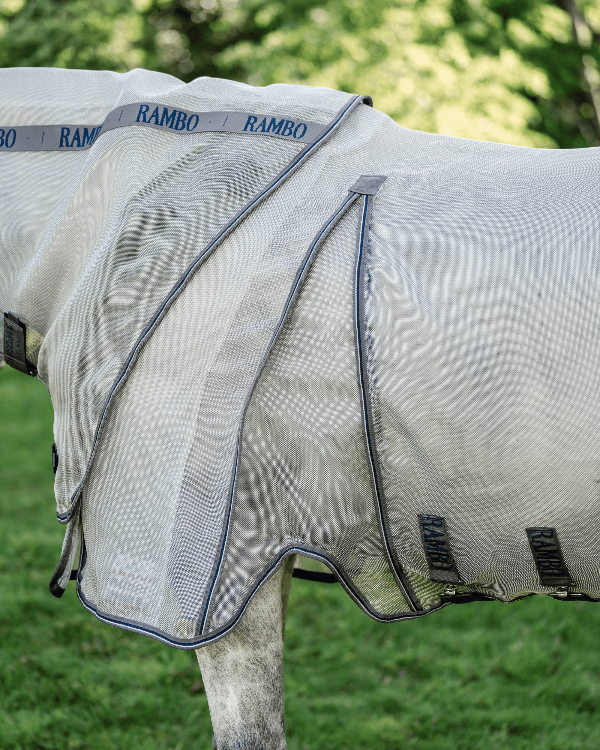 Side view detail of Horseware Rambo Optimo Protector Plus showing extended shoulder design and front closures