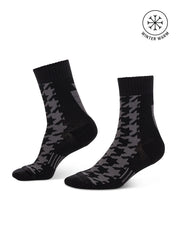 Side views of a pair of black Kerrits Houndstooth Wool Paddock Boot Socks on a white background