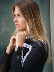 Close-up angled front view of a female model wearing the Criniere Estella Noir Night Long Sleeve Shirt