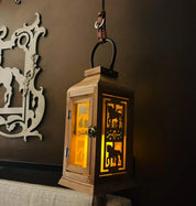 Angled front view of the dressage All Designs Equine Horse Lantern hanging on a brown wall