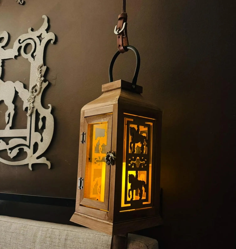 Angled front view of the dressage All Designs Equine Horse Lantern hanging on a brown wall
