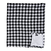 View of the folded up Blue Stallion Farm Black & White Houndstooth Flannel Fleece Blanket in Leather Holder on a white background