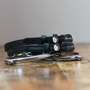 Front view of the buckled Sushi Mane Jane Spur Straps on wood