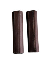 View of a pair of brown DziaSport Eyes Forward Removable Leather Blinkers on a white background