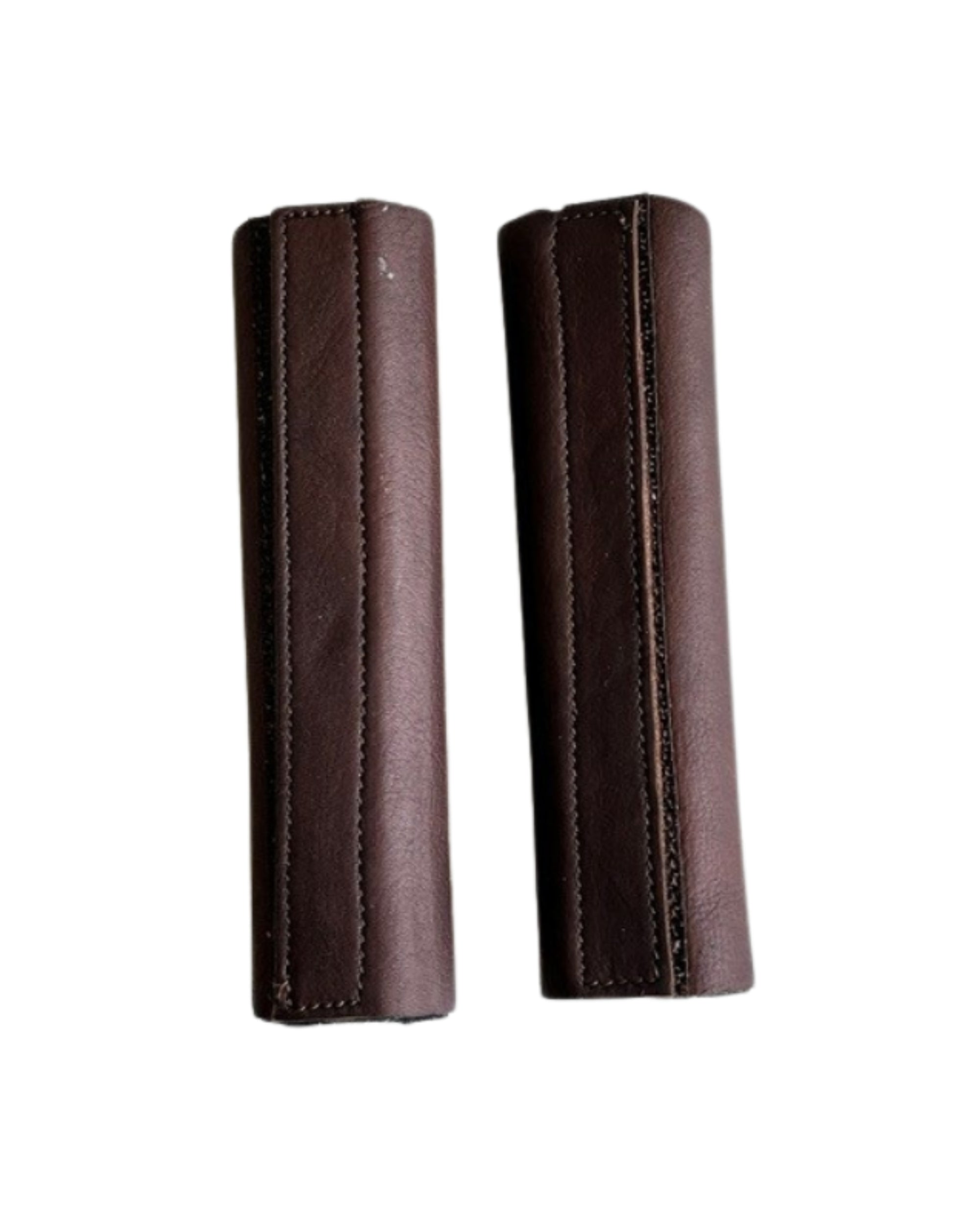 View of a pair of brown DziaSport Eyes Forward Removable Leather Blinkers on a white background