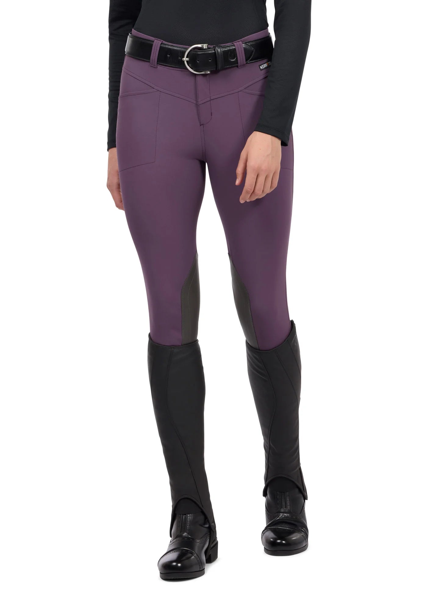 Front view of a model wearing the purple Kerrits Crossover II Knee Patch Riding Breech on a white background