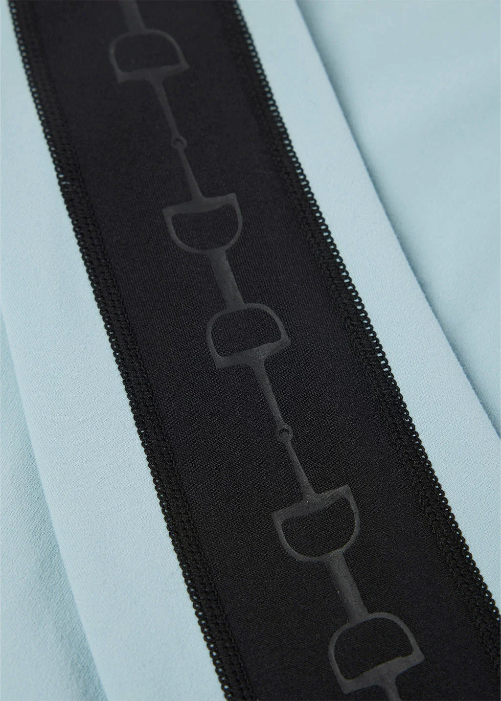 Close-up view of the bit pattern on the sleeve of the Shoreline Kerrits Bit of Base Layer Top