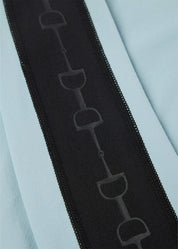 Close-up view of the bit pattern on the sleeve of the Shoreline Kerrits Bit of Base Layer Top