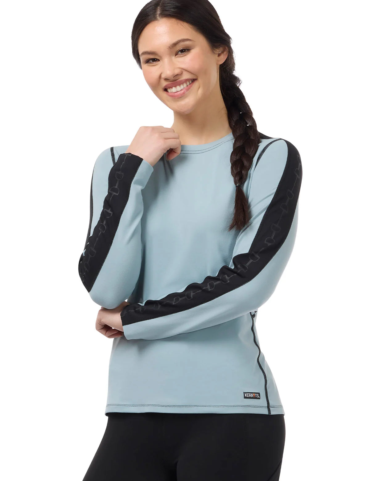 Front view of a female model wearing the Shoreline Kerrits Bit of Base Layer Top on a plain background