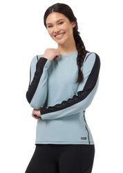 Front view of a female model wearing the Shoreline Kerrits Bit of Base Layer Top on a plain background