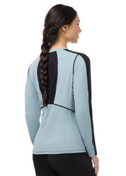 Back view of a female model wearing the Shoreline Kerrits Bit of Base Layer Top on a plain background