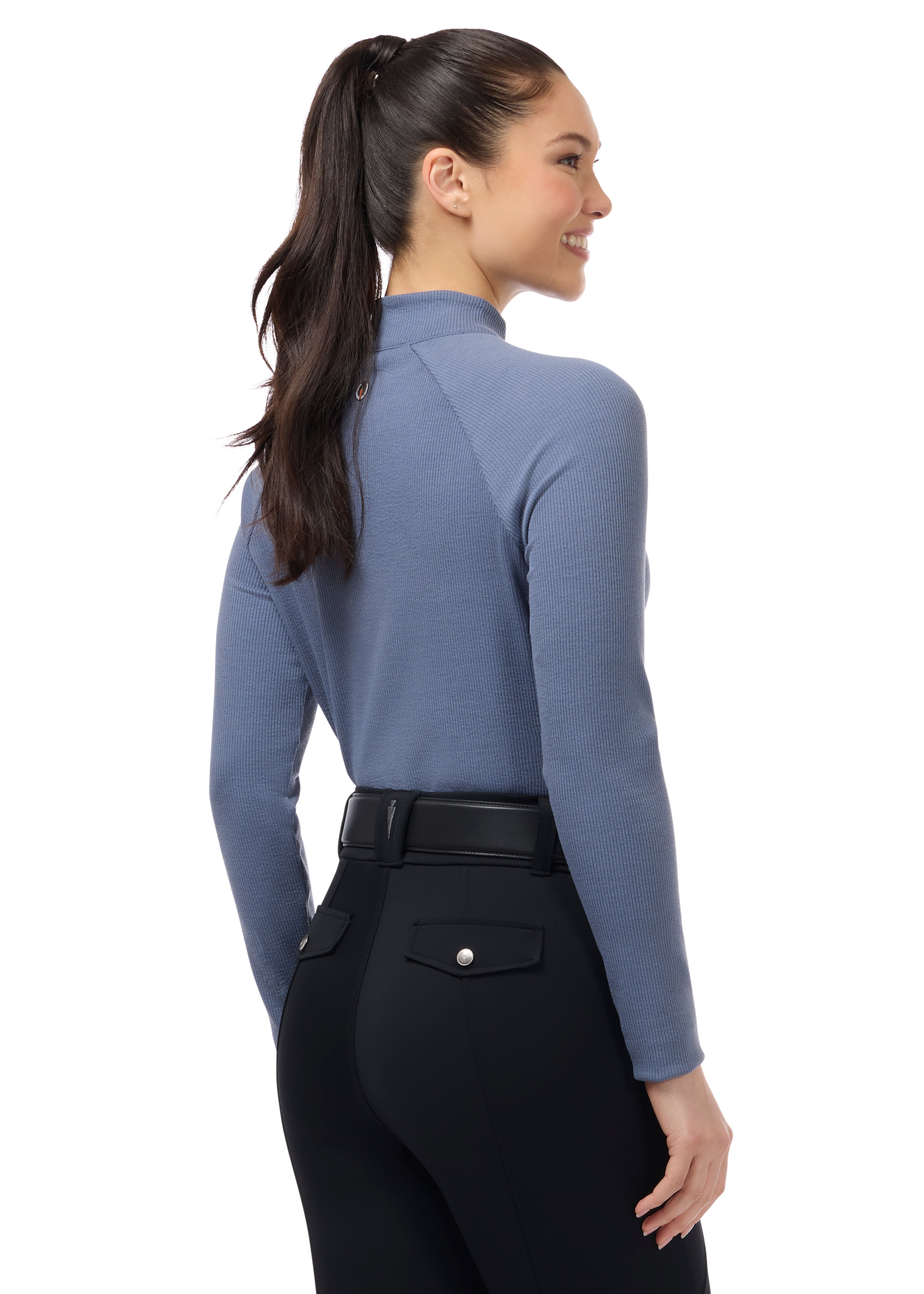 Front view of a female model wearing the Dusty Blue Kerrits Align Textured Mock Neck on a plain background
