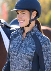 Close-up front view of a model wearing the Dusty Blue Kerrits Traverse Quarter Zip Fleece Tech Top