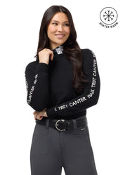 Front view of a female model wearing the Black/White Kerrits Equi Rhythm Crew Neck Sweater on a plain background