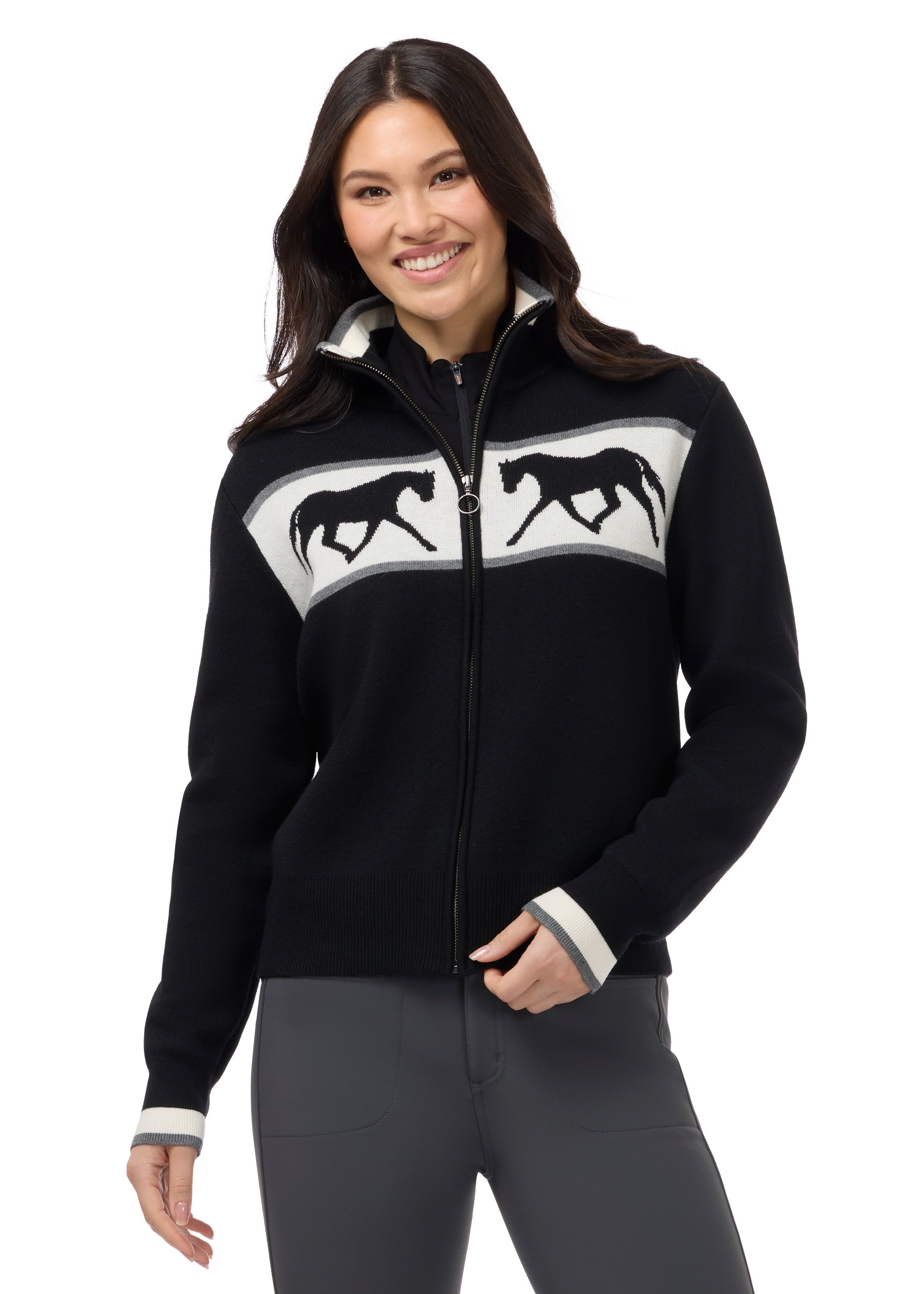 Front view of a model wearing Black Kerrits Reflections Full Zip Sweater on a white background